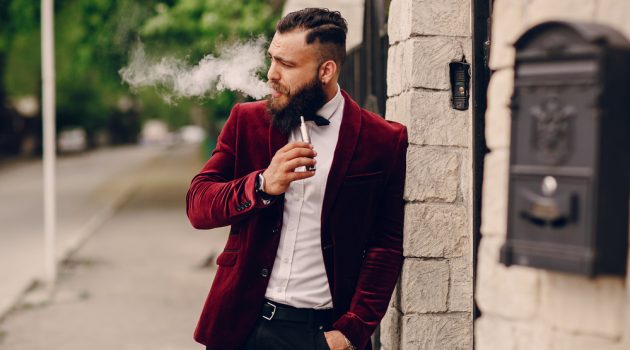 Fresh & Stylish Cannabis Products Man Vaping in Velvet Jacket