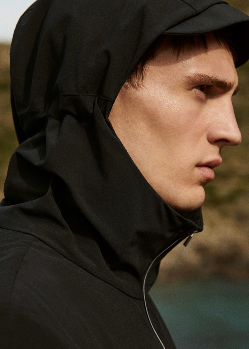 Serving up a side profile, Julian Schneyder rocks a jacket from Mango Man's Active collection.