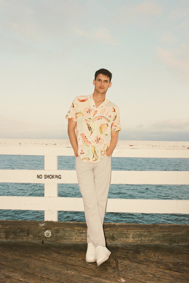 Front and center, Miles Garber dons a fruit print shirt from Zara.