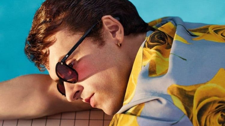 Sporting a floral print shirt, Scott Licznerski stars in Paul Smith's spring-summer 2021 campaign.