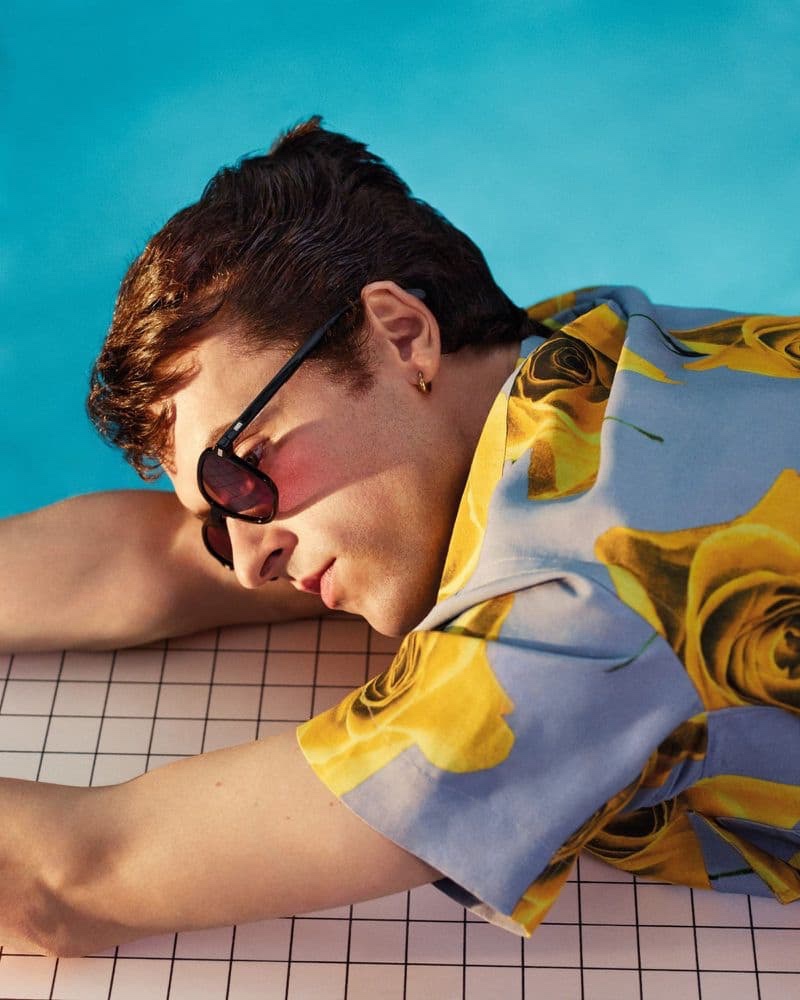 Sporting a floral print shirt, Scott Licznerski stars in Paul Smith's spring-summer 2021 campaign.