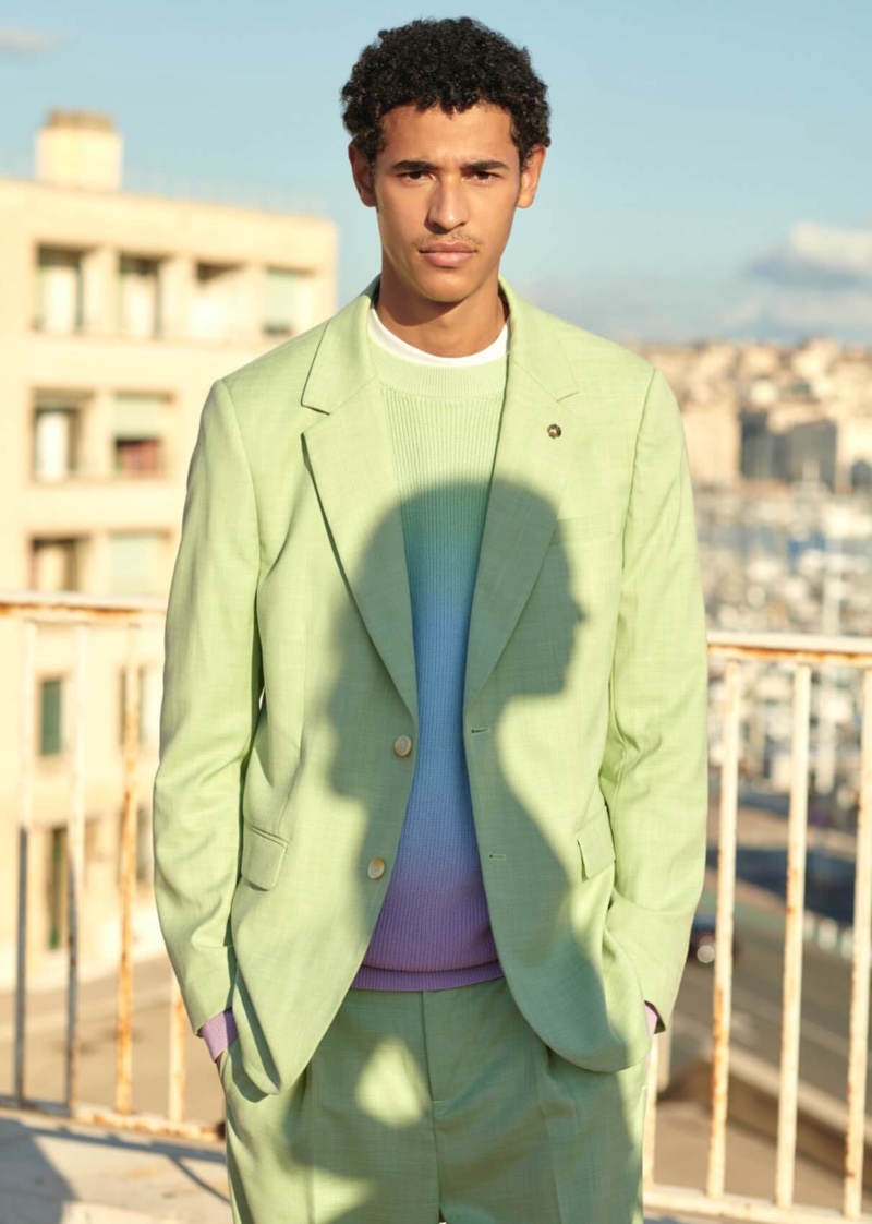 Kaissan Ibrahima stands out in a lime green suit from Scotch & Soda.