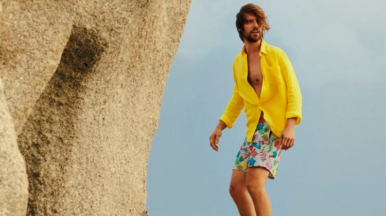 James Crabtree models a yellow shirt with Vilebrequin's 1986 Memphis swim trunks.