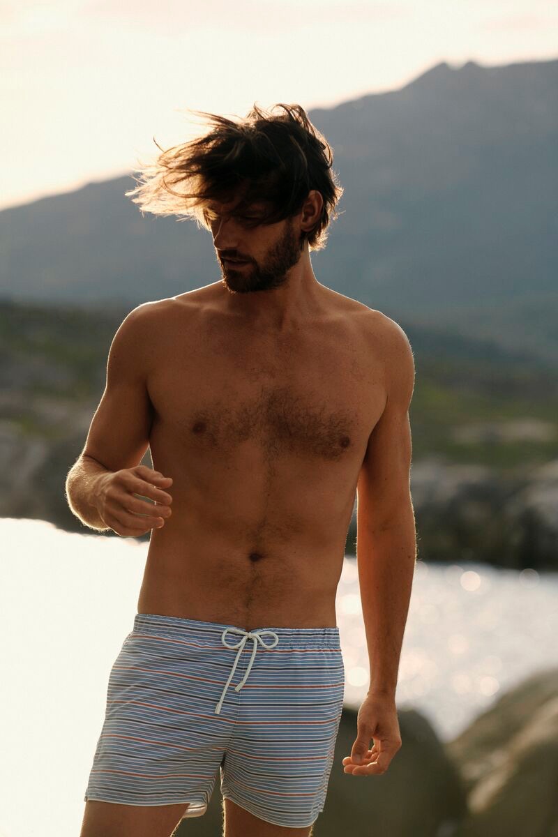 Front and center, James Crabtree dons Vilebrequin's Vintage 1971 Rayures Seersucker swim trunks. » Vilebrequin Kicks Off 50th Anniversary Celebration with Nostalgic Summer Front and center, James Crabtree dons Vilebrequin's Vintage 1971 Rayures Seersucker swim trunks.