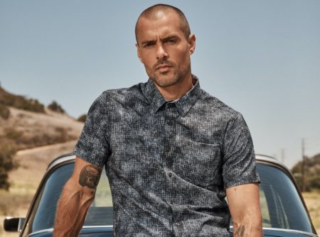 Sporting a printed short-sleeve shirt, Zac Taylor fronts 7Diamonds' summer 2021 campaign.