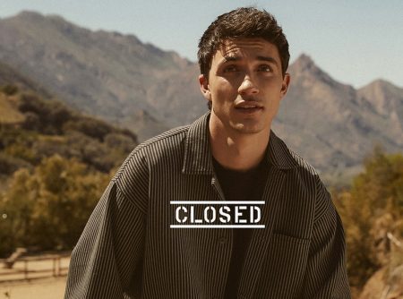 Jacob Bixenman wears a matching striped overshirt and pants for Closed's summer 2021 campaign.