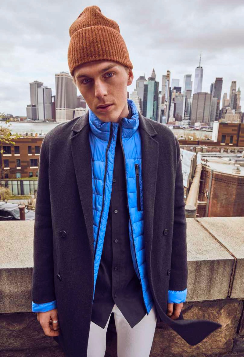 Pero Simic dons a double-breasted coat with a blue puffer jacket from DKNY's fall-winter 2021 men's collection. » Pedro, Peter & Raphael Don Urban Style in DKNY Fall '21 Collection Pero Simic dons a double-breasted coat with a blue puffer jacket from DKNY's fall-winter 2021 men's collection.
