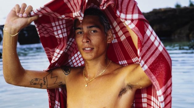 All You Need to Know About the New Evan Mock & RVCA Collaboration Taking to the beach, Evan Mock wears his RVCA Palaka plaid board shorts and covers up in a matching blanket.