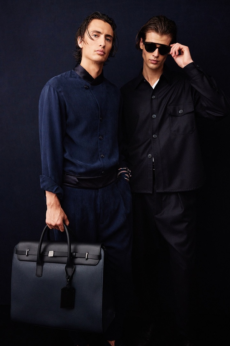 James Turlington and Bastien De Bels pose behind the scenes at Giorgio Armani's spring-summer 2022 show.