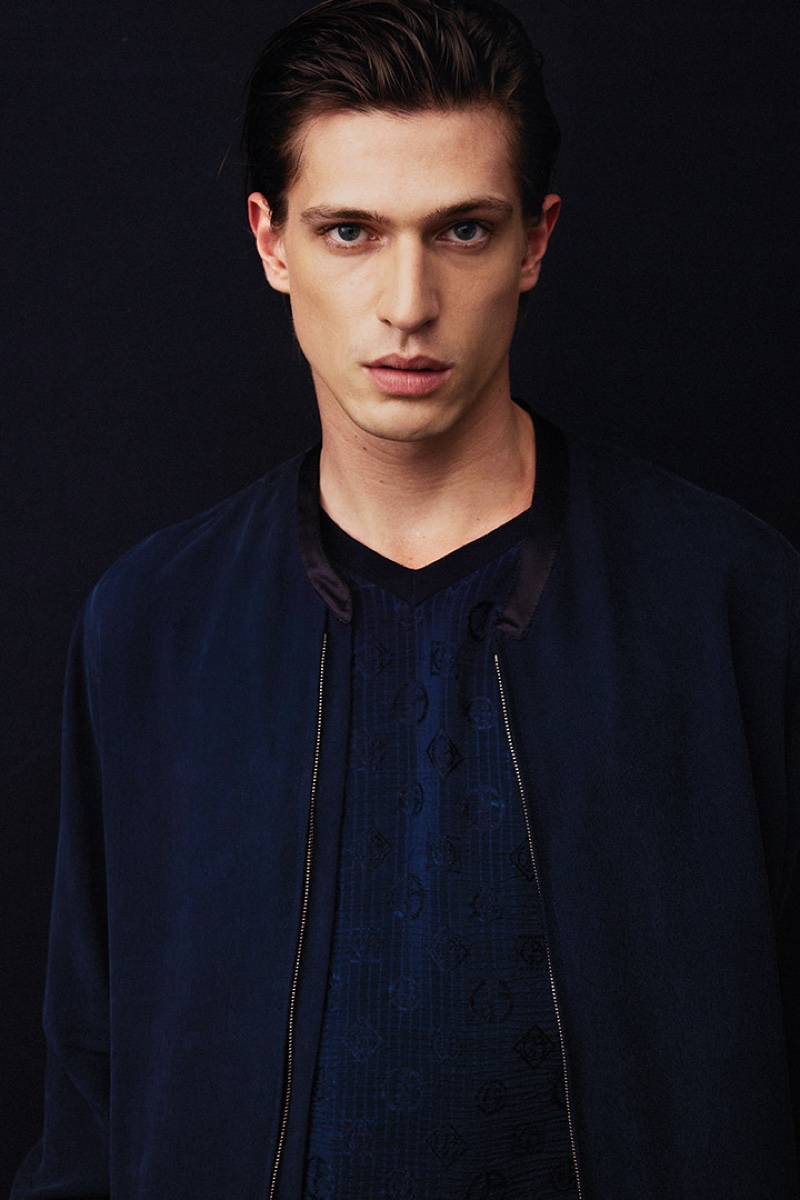 Edoardo Sebastianelli models a navy look from Giorgio Armani's spring-summer 2022 collection.