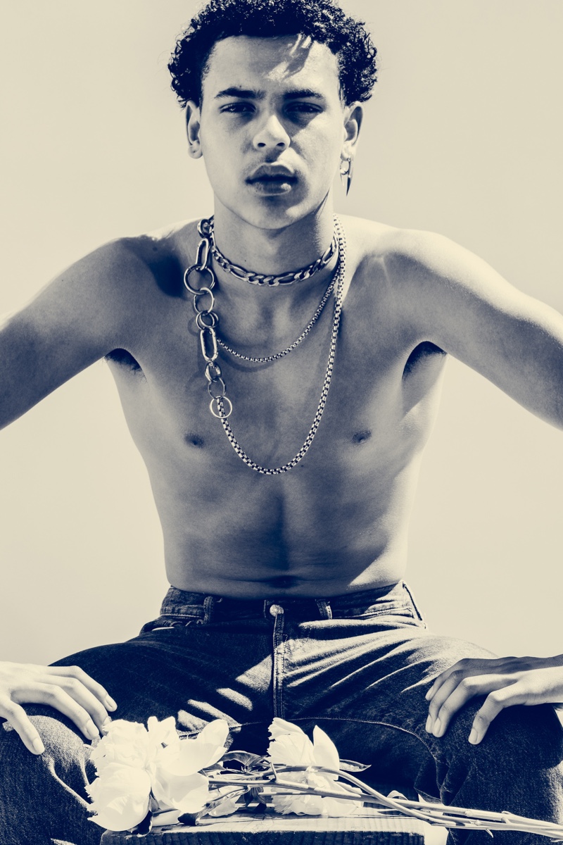 Isaac Searcy wears necklace Martine Ali and earring Austin James Smith.