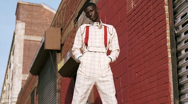 Ibby Sow Turns Heads in Fall Style Ibby wears jumpsuit Casablanca, boots Dr Martens, and suspenders Club Room.