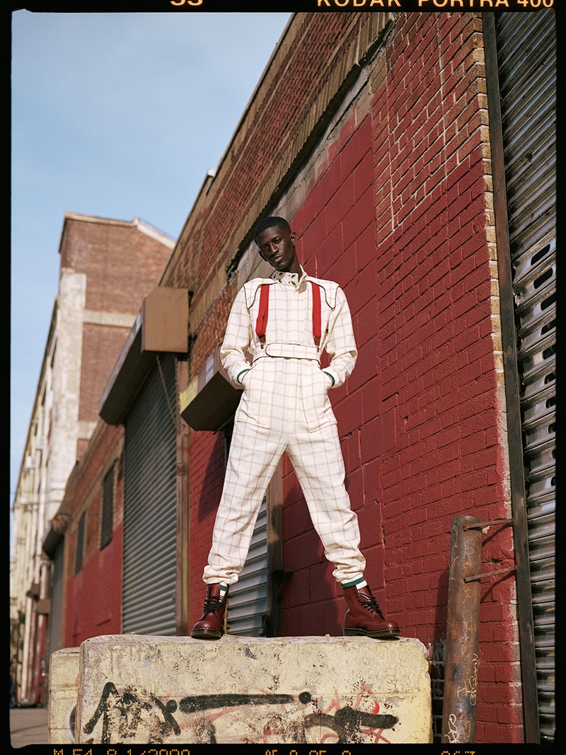 Ibby wears jumpsuit Casablanca, boots Dr Martens, and suspenders Club Room.