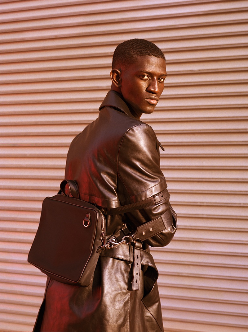 Ibby wears coat Casablanca and bag Bond Hardware.