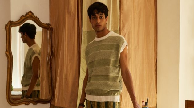 Luca Larenza Looks East for Spring '22 Collection Matteo Tagliabue wears a striped sweater vest and patterned pants from Luca Larenza's spring-summer 2022 collection.