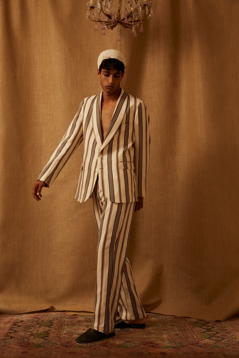 Making a smart statement in Luca Larenza, Matteo Tagliabue inspires in a striped suiting number.