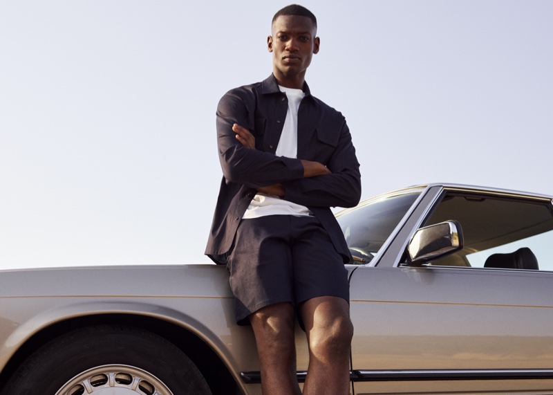  Taking front and center, Bambi Kouyate showcases smart style in a matching shirt and shorts from Mango Man's Clean collection.