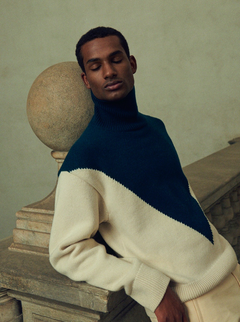 Omar Didiba charms in an oversized sweater from Jil Sander for Mytheresa's pre-fall 2021 men's campaign.