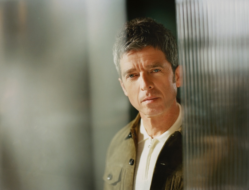 Tom Craig photographs Noel Gallagher for Mr Porter. The music artist wears an Officine Générale suede bomber jacket with a Mr P. cotton half-zip polo shirt.