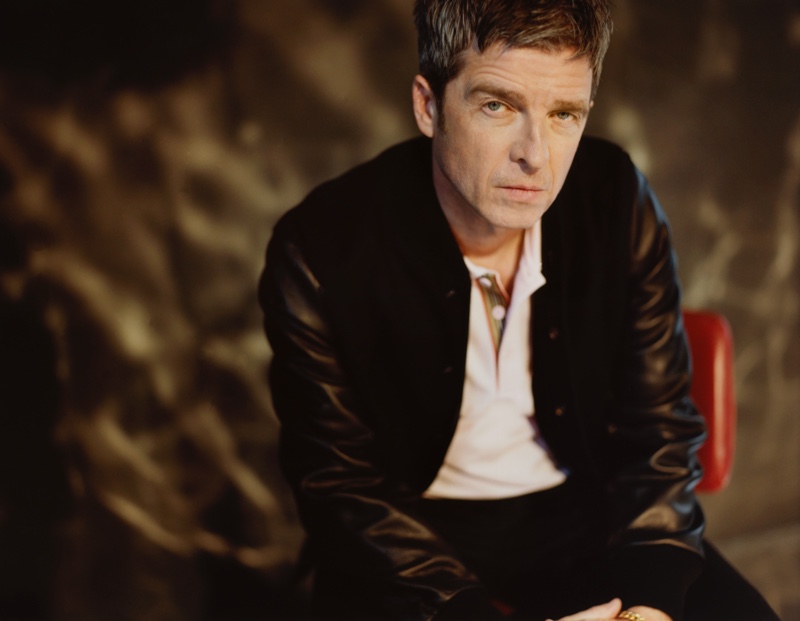 Sporting a Golden Bear wool-blend and leather bomber jacket with a Burberry logo-embroidered contrast-tipped cotton-piqué polo shirt, Noel Gallagher appears in Mr Porter's The Journal. He also dons Nudie Jeans slim-fit organic denim jeans.