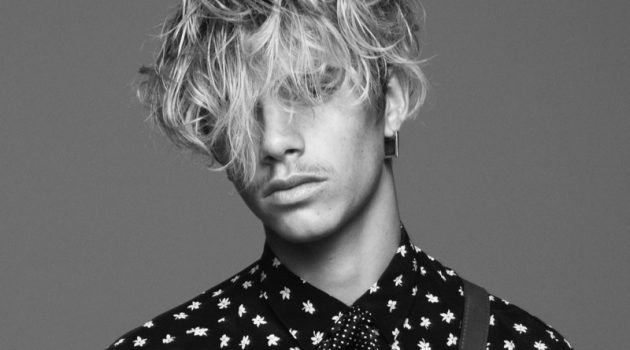 Romeo Beckham rocks a printed shirt and polka dot bow for Saint Laurent's fall-winter 2021 men's campaign.