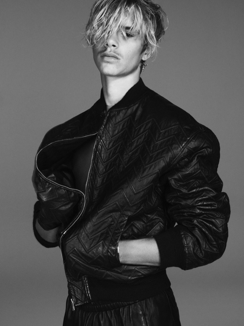 Styled in a leather bomber jacket, Romeo Beckham appears in Saint Laurent's fall-winter 2021 men's campaign.