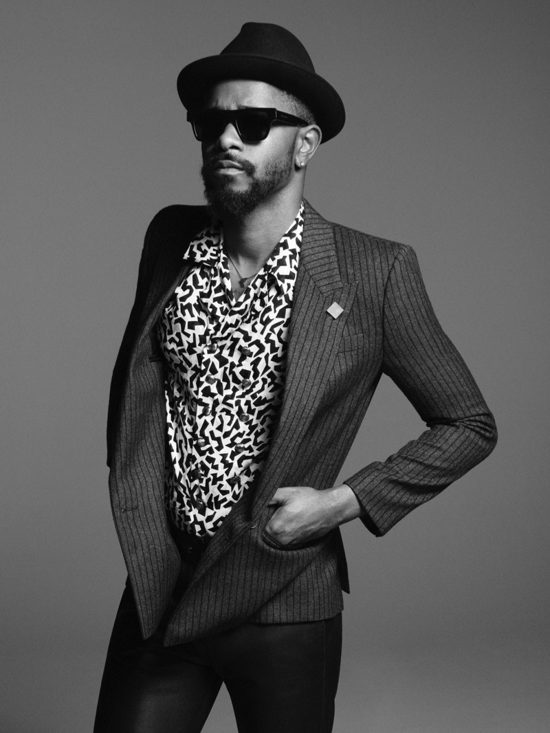 Actor Lakeith Stanfield dons slender tailoring, a fedora, and sunglasses for Saint Laurent's fall-winter 2021 men's campaign.