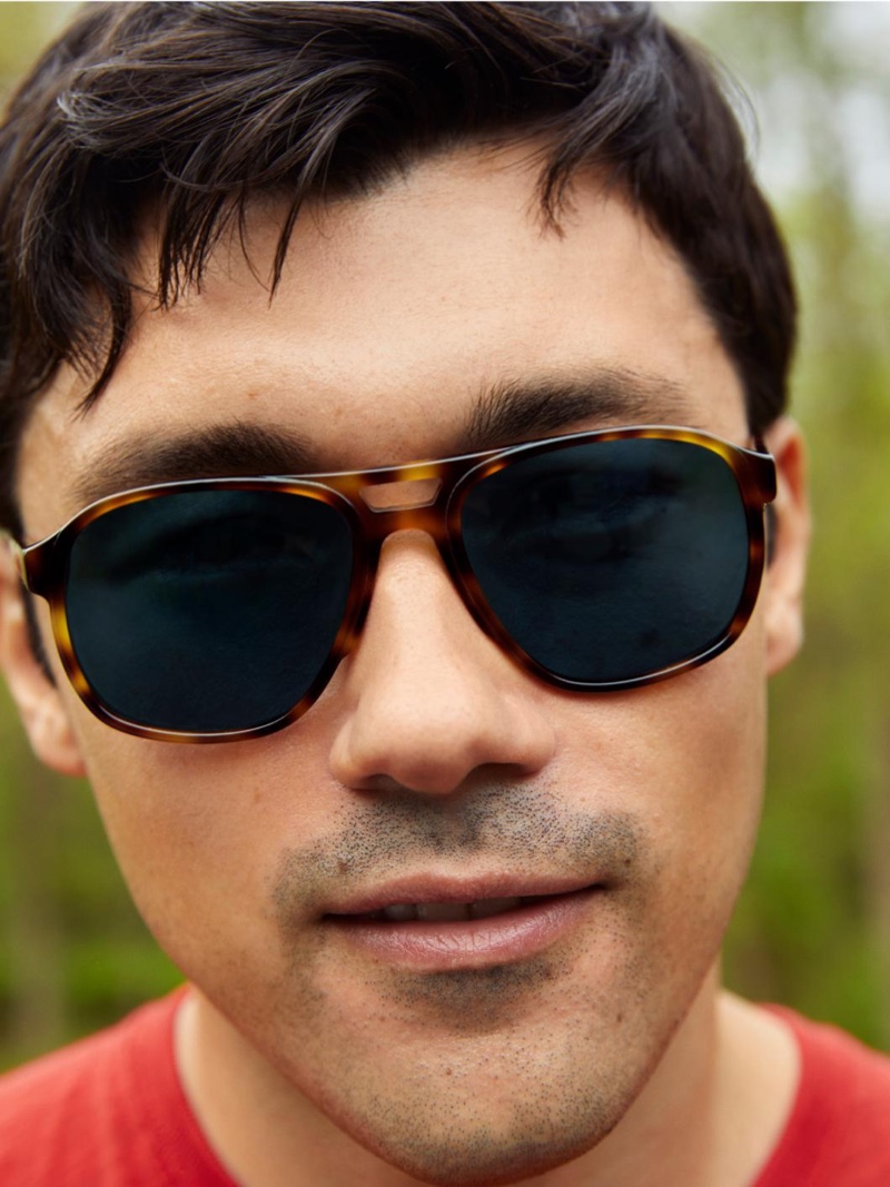 Front and center, Ruslan Aliiev sports Warby Parker's Hatcher sunglasses in Oak Barrel.