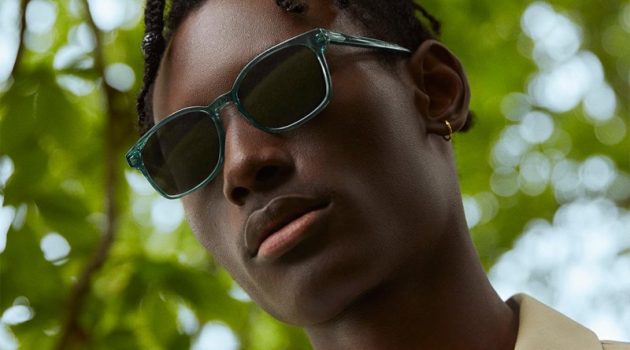 Warby Parker enlists model Youssouf Bamba to wear its colorful Hemmings sunglasses in Viridian.