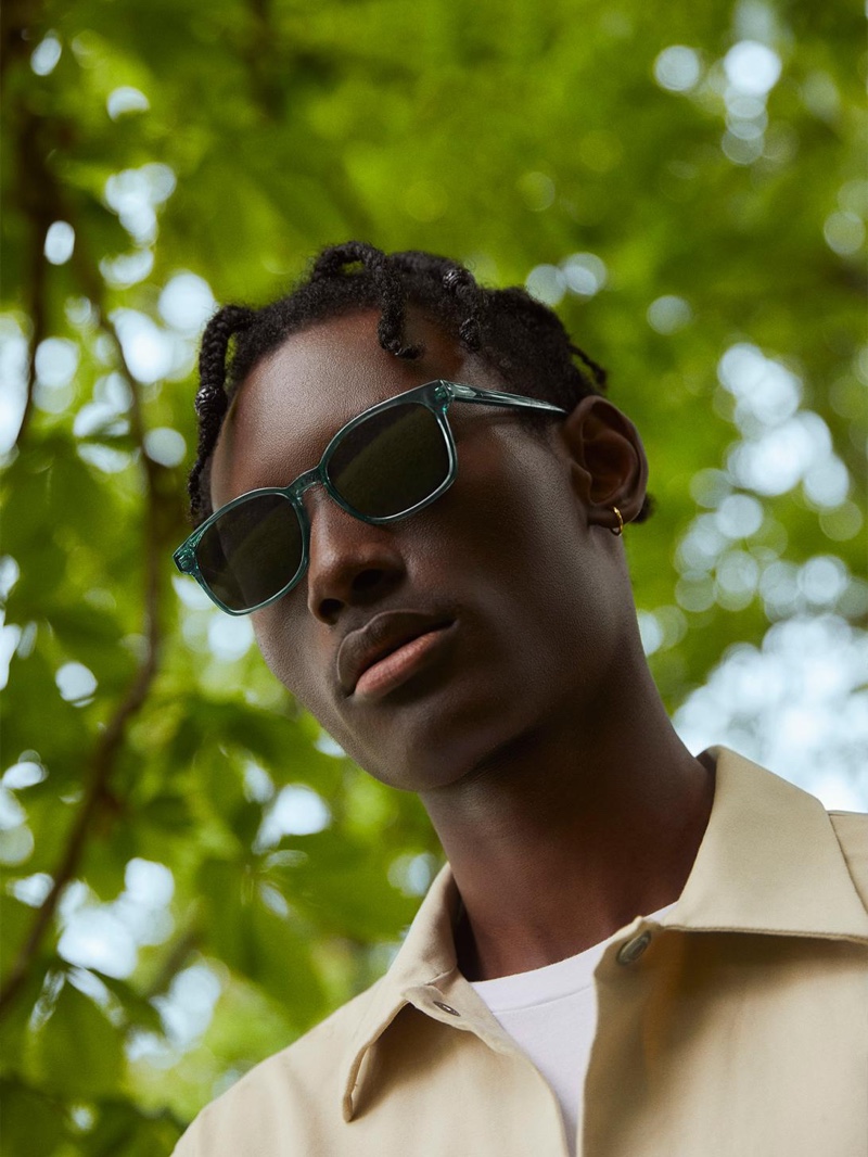 Warby Parker enlists model Youssouf Bamba to wear its colorful Hemmings sunglasses in Viridian.