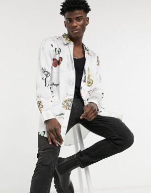 ASOS DESIGN regular longline satin shirt in white negative placement motifs print ASOS DESIGN regular longline satin shirt in white negative placement motifs print