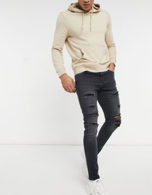 ASOS DESIGN skinny jeans in washed black with thigh rip ASOS DESIGN skinny jeans in washed black with thigh rip