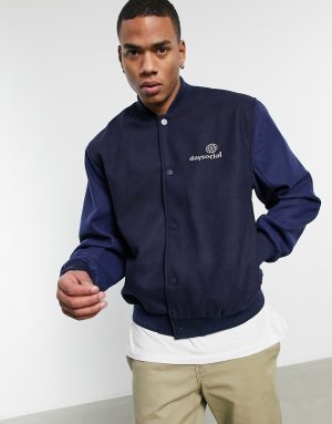 ASOS Daysocial oversized varsity jacket in navy with contrast blue sleeves ASOS Daysocial oversized varsity jacket in navy with contrast blue sleeves