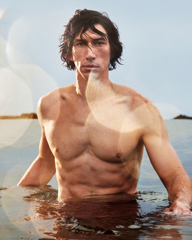 Emerging from the water shirtless, Adam Driver stars in the Burberry Hero fragrance campaign.