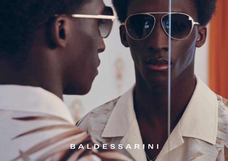 Amadou dons sleek sunglasses for Baldessarini's spring-summer 2022 campaign.