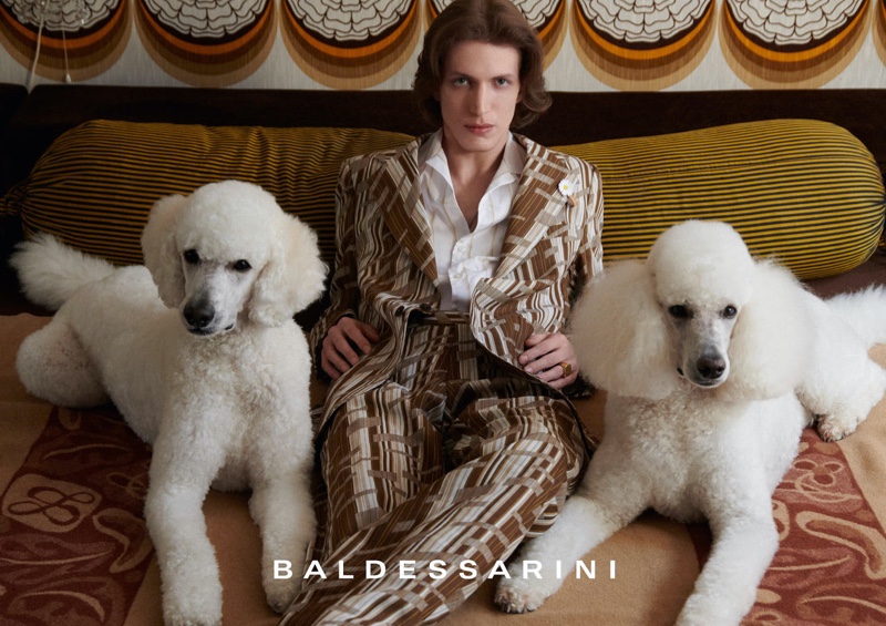 Donning a patterned suit and posing with poodles, Xavier Buestel stars in Baldessarini's spring-summer 2022 campaign.