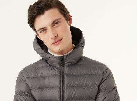 Gabriel Daum stays warm in a Colmar Originals sporty hooded down jacket in grey.