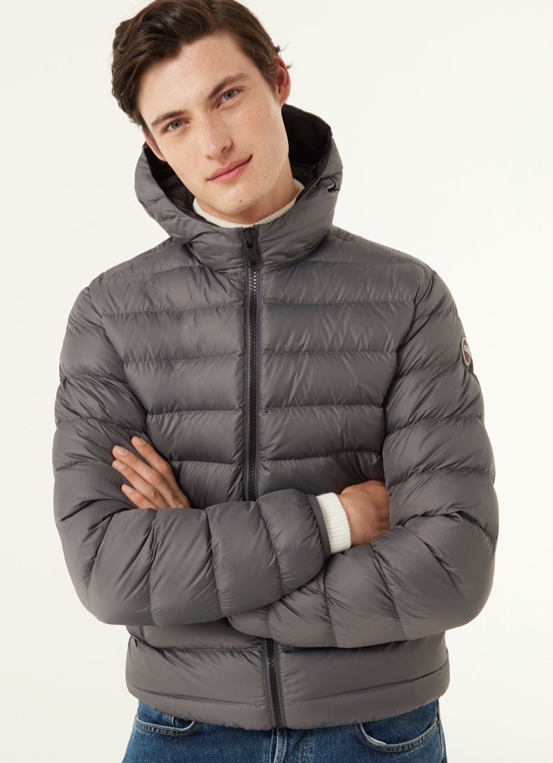 Gabriel Daum stays warm in a Colmar Originals sporty hooded down jacket in grey.