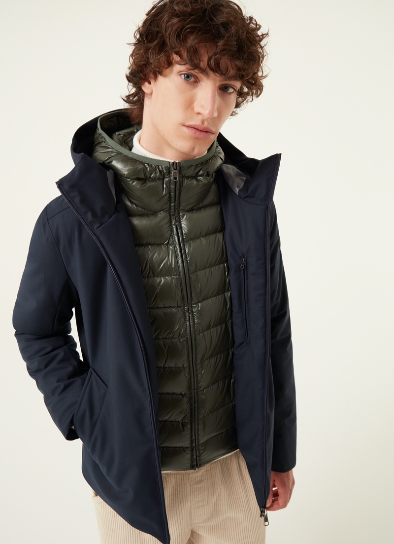 Front and center, Oliver Bartha models Colmar Originals' 3-layer down jacket with water-repellent wool effect in blue.