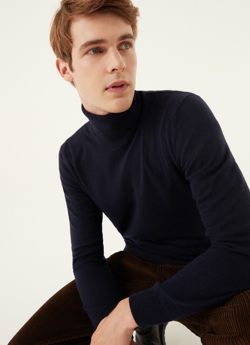 Max Lusth is a smart vision in a Colmar Originals wool and cashmere blend turtleneck in blue.