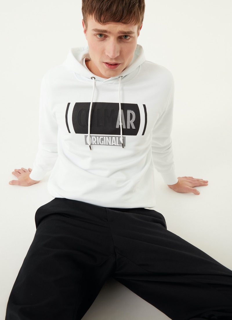 Marco De Sario goes casual in Colmar Originals' sweatshirt with crossed out writing.