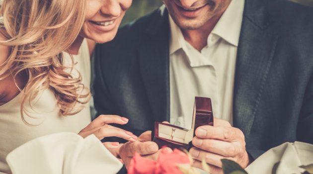 Top 5 Things You Need to Know Before Buying an Engagement Ring Couple Looking Engagement Ring Box