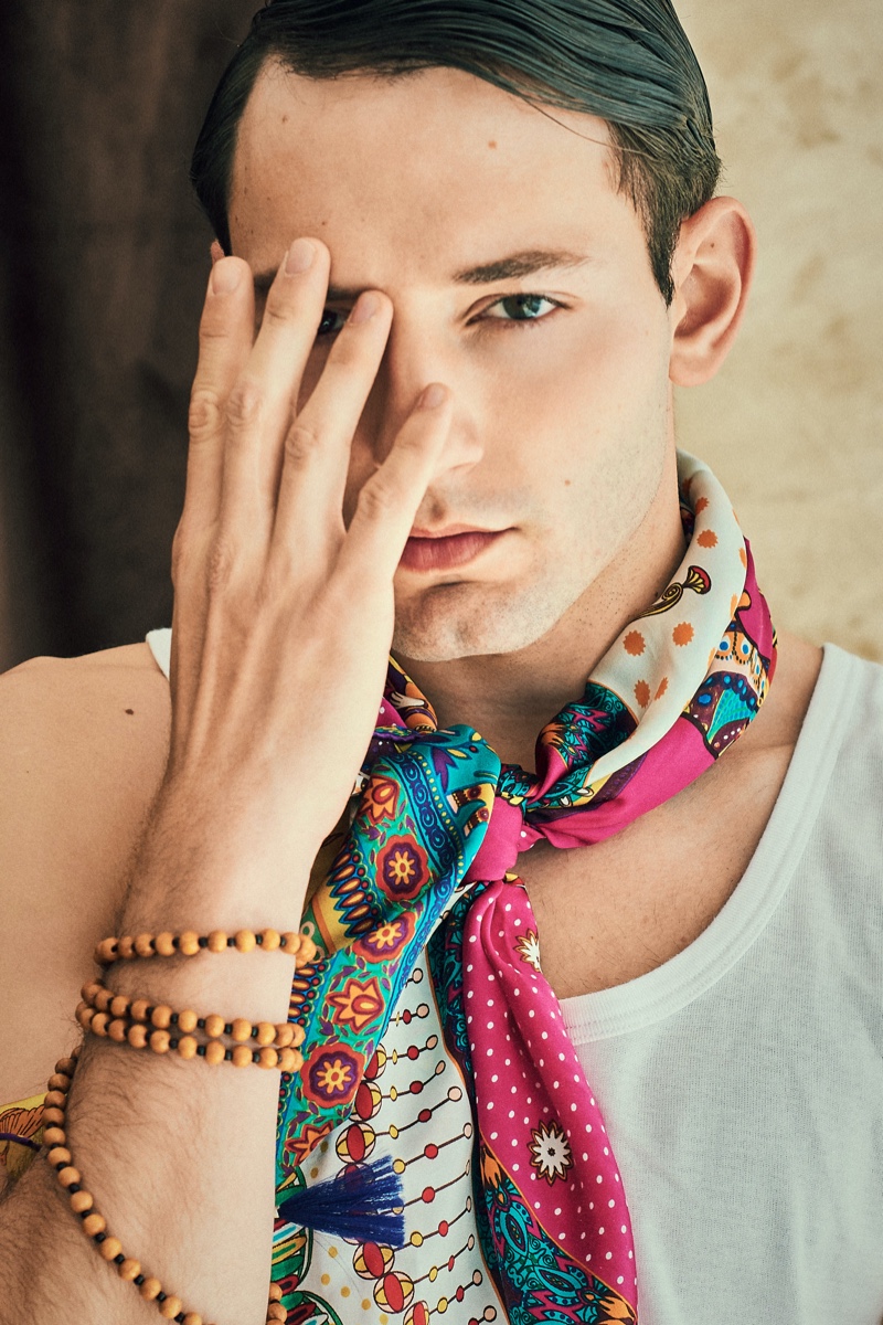 Guille wears scarf Prada, bracelet Bodhi Mala, and tank Calvin Klein.