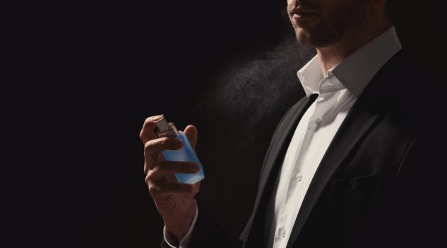 Popular Colognes for Men This Year Man Spraying Cologne