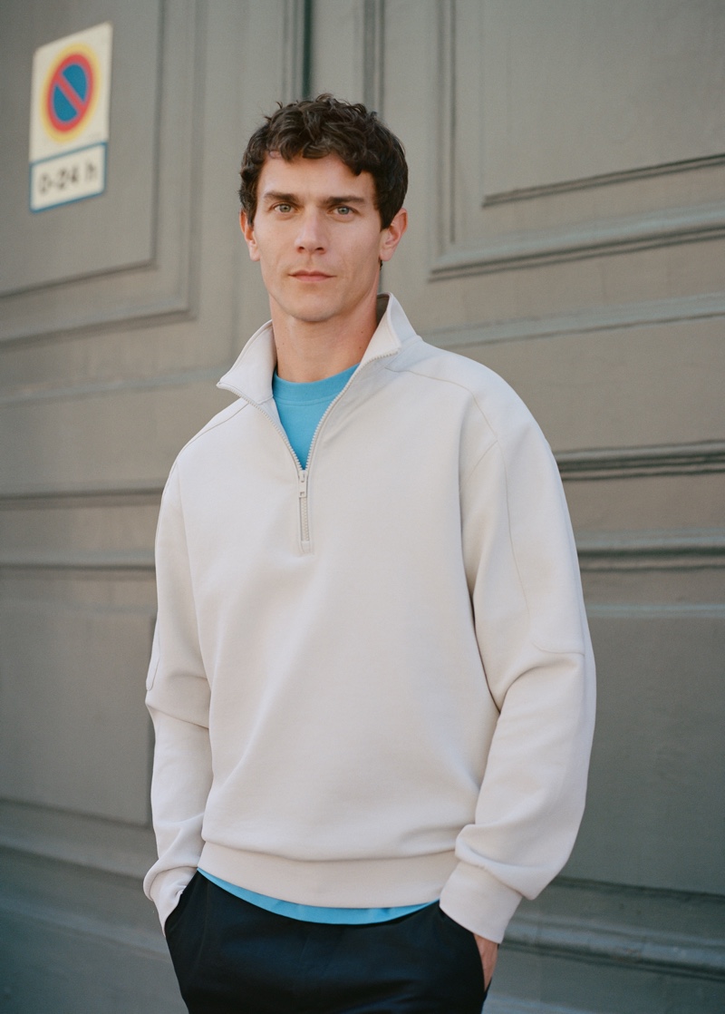 Front and center, Vincent Lacrocq sports a half-zip pullover from Mango Man's Leisure collection.