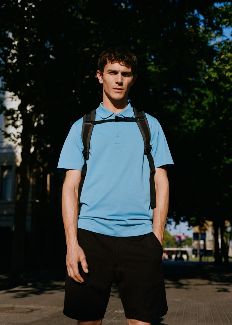 On the move, Vincent Lacrocq wears a polo shirt and shorts from Mango Man's Leisure collection.