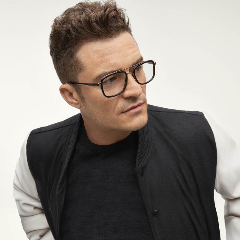 Orlando Bloom dons black framed glasses for BOSS's eyewear campaign.