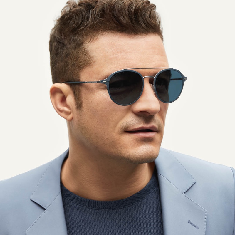 Making a blue statement, Orlando Bloom dons BOSS' blue acetate sunglasses with silver-effect double bridge.