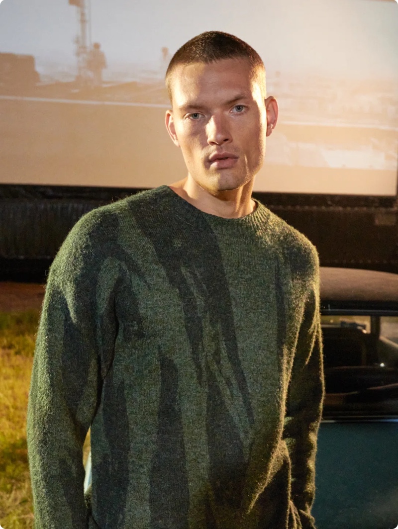 Front and center, William Los wears a Kenzo sweater for Stylebop.