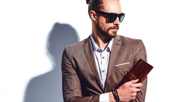 5 Accessories Every Man Needs in 2021 Stylish Man with Wallet Bracelet and Sunglasses